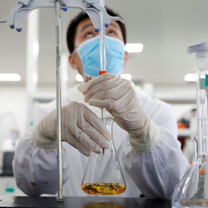 A man works in a Sinovac Biotech laboratory in Beijing. An experimental Covid-19 vaccine developed by the company is one of four Chinese candidates in the final stage of human trials. Photo: Reuters