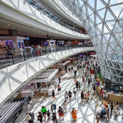 Tourists at a Sanya City duty-free shopping centre in southern Hainan province. China has ample scope to increase consumer spending and domestic growth, with its high personal savings rate. Photo: Xinhua