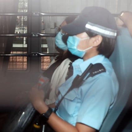 Chung Suet-ying (rear) is escorted to Fanling Court to be charged with one count of possession of arms or ammunition without a licence on Monday. Photo: K. Y. Cheng
