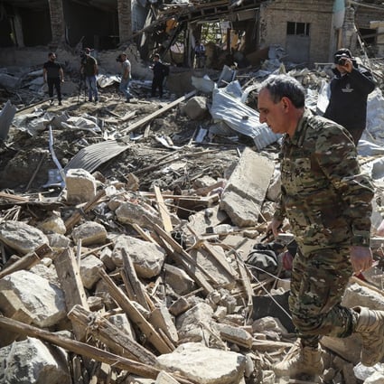Rescuers look through the rubble of houses damaged by recent shelling in Ganja, Azerbaijan, October 11. Photo: EPA-EFE