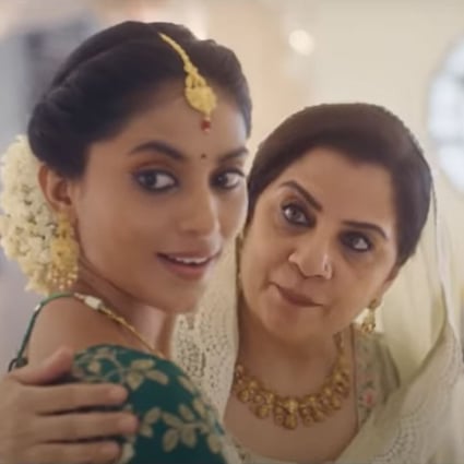 A still from Tanishq‘s pulled ’Ekatvam’ advert shows the pregnant Hindu wife character being escorted to her baby shower by an older Muslim woman she calls mother. Photo: YouTube