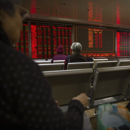 Chinese investors monitor stock prices at a brokerage house in Beijing, China. The market ekes out a small gain after surpassing the US$10 trillion mark on October 12, 2020. Photo: AP