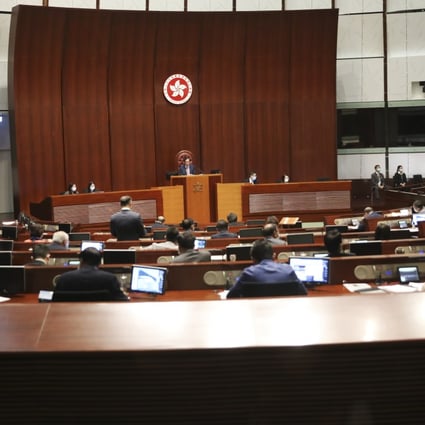 Lawmakers wearing masks attend a Legco meeting at Legislative Council Complex in Tamar. Photo: K. Y. Cheng