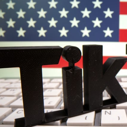A 3D printed Tik Tok logo is placed on a keyboard in front of US flag in this illustration taken October 6, 2020. Photo: Reuters
