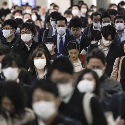 Commuters are seen walking to their offices in Tokyo. About 71 per cent of Japanese firms said women accounted for less than a tenth of management, while 17 per cent had no female managers at all. Photo: EPA-EFE