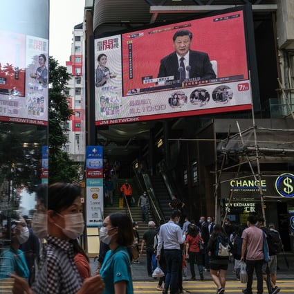 A news report on President Xi Jinping’s speech in Shenzhen is shown on a gigantic screen in Hong Kong. Photo: Bloomberg