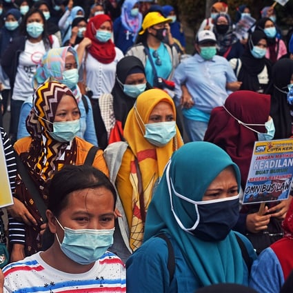Members of Indonesian trade unions protest against the new jobs bill in Serang, Banten Province on October 14, 2020. Photo: Antara Foto via Reuters