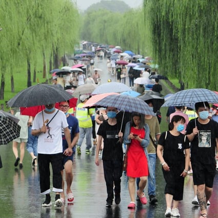 Residents of Hangzhou, the capital of Zhejiang province. Photo: Getty Images