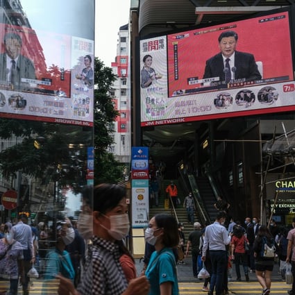 President Xi Jinping’s speech in Shenzhen is shown on an outdoor screen in Hong Kong last Wednesday. Photo: Bloomberg