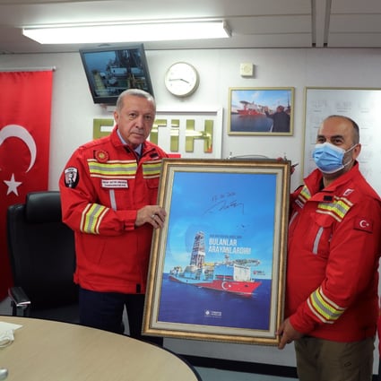 Turkish President Recep Tayyip Erdogan, left, visits the Turkish drilling vessel Fatih in Zonguldak, Turkey on Saturday. Photo: EPA-EFE