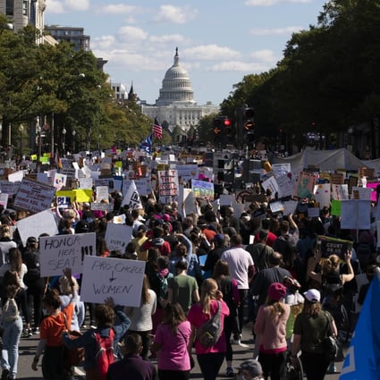 With the US Capitol in the background, demonstrators march on Pennsylvania Avenue during the Women's March in Washington. Photo: AP