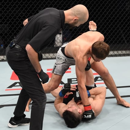 Said Nurmagomedov punches Mark Striegl of the Philippines in their bantamweight bout during the UFC Fight Night event inside Flash Forum on UFC Fight Island on October 18, 2020 in Yas Island, Abu Dhabi, United Arab Emirates. Photos: Josh Hedges/Zuffa LLC via Getty Images