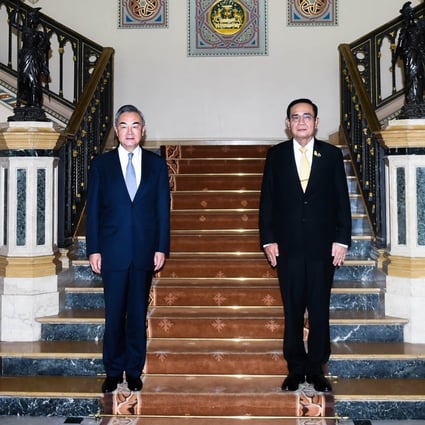 China’s Foreign Minister Wang Yi with Thailand’s Prime Minister Prayuth Chan-ocha at Government House in Bangkok. Photo: AFP