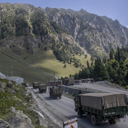 An Indian army convoy moves on the Srinagar- Ladakh highway in Indian-controlled Kashmir. Photo: AP