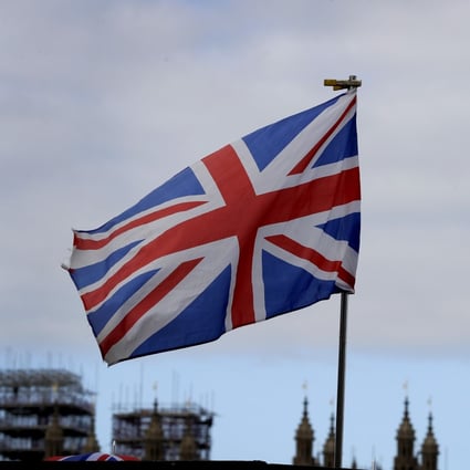 The Union flag flies in front of Big Ben in London on Friday. Photo: AP