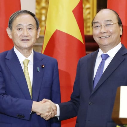 Japanese Prime Minister Yoshihide Suga (left) agreed with his Vietnamese counterpart Nguyen Xuan Phuc for the countries to work together on issues including the South China Sea. Photo: Kyodo