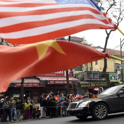 The US and Vietnamese flags are waved in Hanoi as a motorcade transports North Korean leader Kim Jong-un to a summit with President Donald Trump. Photo: AP