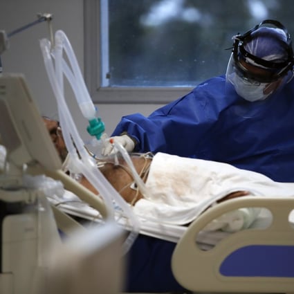 A heath worker attends to a patient in an intensive care unit in Buenos Aires, Argentina. Photo: AP