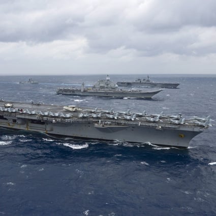 The American aircraft carrier USS Nimitz leads a formation of ships from the Indian navy, Japan Maritime Self-Defense Force and the US Navy in the 2017 Malabar exercises. Photo: AFP