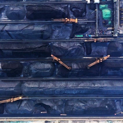 An aerial photo shows workers cleaning and transporting coal to a designated site inside the Shijiu Port Area of Rizhao Port in Rizhao City, in eastern China's Shandong province, in October 2019. Photo: Xinhua