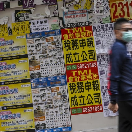 A pedestrian walking past closed retail shops in Mong Kok on 24 February 2020. Photo: K.Y. Cheng