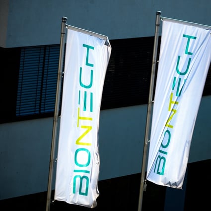 The logo of BioNTech on flags in front of the company headquarters in Mainz, Germany. Photo: dpa