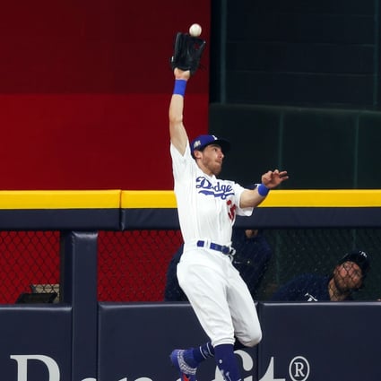 Cody Bellinger of the Los Angeles Dodgers catches a fly ball during game one of the World Series. Photo: AFP