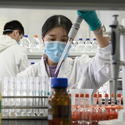 A Sinovac employee works in a lab at a factory producing CoronaVac, a vaccine against Covid-19, in Beijing. Photo: AP Photo