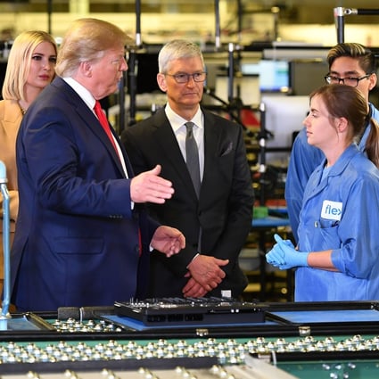 US President Donald Trump and Apple CEO Tim Cook tour the Flextronics manufacturing facility where Apple’s Mac Pros are assembled in Austin, Texas. Photo: AFP via Getty Images