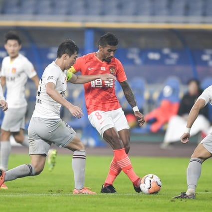 Paulinho (second from right) was on the scoresheet for Guangzhou Evergrande in their win over Hebei China Fortune. Photo: Xinhua