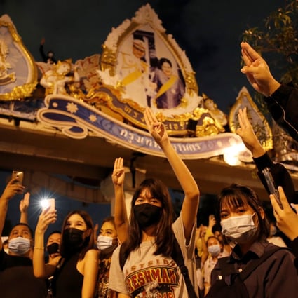 Pro-democracy protesters make a three-finger salute during an anti-government protest in Bangkok on October 21. Photo: Reuters