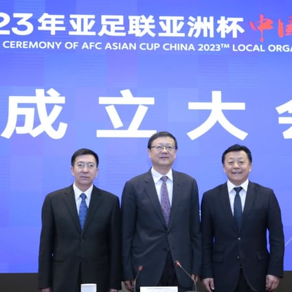Chen Jining (centre), Zhang Jiandong (left) and Du Zhaocai pose after the inaugural ceremony of AFC Asian Cup 2023 local organising committee in Beijing. Photo: Xinhua