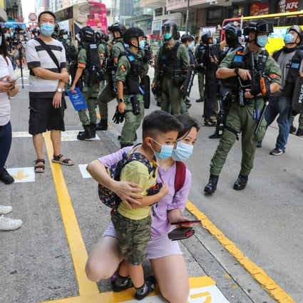 Police officers stand guard on Nathan Road in Hong Kong in September during protests against the new national security law. Photo: May Tse