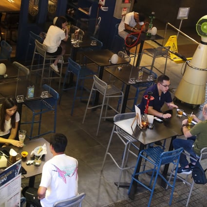 Patrons enjoy a drink at a bar in Tsim Sha Tsui on October 5. Hong Kong bars had been closed for three of the last six months to comply with the government’s pandemic containment measures, before they reopened on September 18. Photo: Edmond So