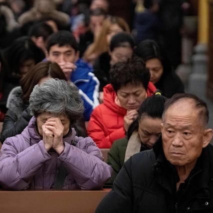 Worshippers are seen at a Christmas Eve mass at the Xishiku Cathedral in Beijing in 2019. Photo: AFP