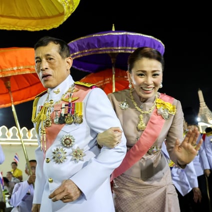 Thailand‘s King Maha Vajiralongkorn and Queen Suthida greet royalists as they leave a religious ceremony in Bangkok on Friday. Photo: Reuters