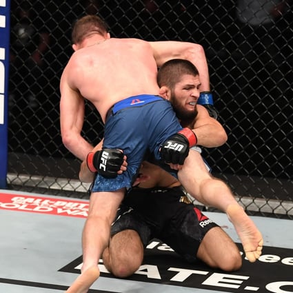 Khabib Nurmagomedov takes down Justin Gaethje in their lightweight title bout at UFC 254 on Fight Island in Abu Dhabi. Photo: Josh Hedges/Zuffa LLC via Getty Images