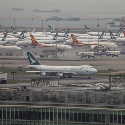 Planes sit grounded on the tarmac at Hong Kong International Airport on March 20. Cathay Pacific and Cathay Dragon are the latest to experience steep job losses as the ongoing pandemic leaves carriers around the world facing severe financial difficulties. Photo: Winson Wong