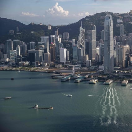 Hong Kong seen in the background of Victoria Harbour. Competition for investment banking advisory roles has intensified as Chinese firms waded into the market as part of their international expansion. Photo: AFP