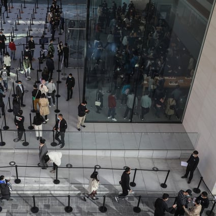 People line up to enter an Apple store in Beijing on October 23 as the sales begin for the new iPhone 12 and iPhone 12 Pro. China’s economy is recovering and consumer demand is picking up. Photo: EPA-EFE