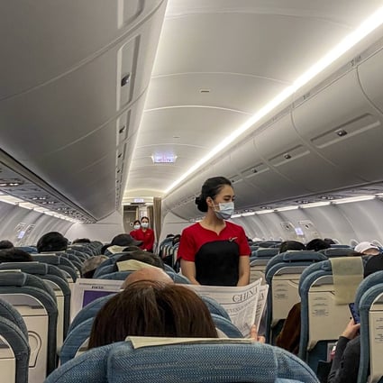 Cathay Dragon cabin crew on a flight into Wuhan, in Hubei province, on January 3, during the early days of the Covid-19 outbreak in mainland China. Photo: Linda Lew