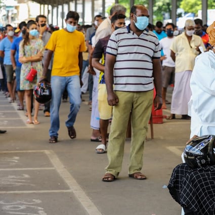Health workers carry out coronavirus tests at a bus terminal in Colombo. Photo: EPA-EFE