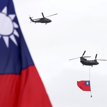 Military helicopters fly Taiwan’s flag over the President’s Office during National Day celebrations in Taipei on October 10. Photo: AP