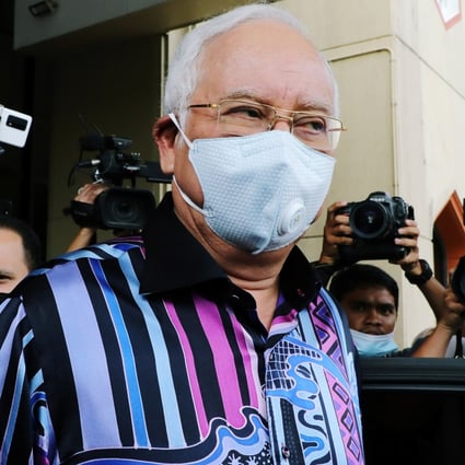 Former Malaysian PM Najib Razak leaves after a meeting at UMNO’s headquarters in Kuala Lumpur on October 26, 2020. Photo: Reuters