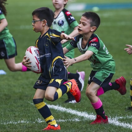 Boys and girls play together in a mini rugby game at the Hong Kong Sevens in 2019. Photo: Jonathan Wong