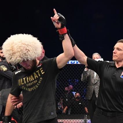 Khabib Nurmagomedov celebrates his victory over Justin Gaethje in their lightweight title bout at UFC 254. Photo: Josh Hedges/Zuffa LLC via Getty Images