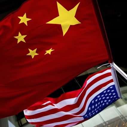 US and Chinese national flags are seen hung outside a hotel in Beijing in 2012. Photo: AP