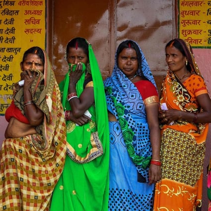 Voters queue up to cast their ballots in Masaurhi on October 28, 2020. Photo: AFP