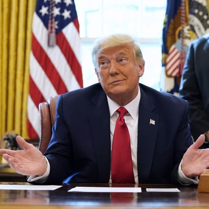 President Donald Trump on a phone call with the leaders of Sudan and Israel, as Secretary of State Mike Pompeo looks on, in the Oval Office on October 23. Photo: AP