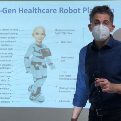 David Hanson who created Sophia the robot, shows a poster of Grace, the upcoming health care robot, designed to care for the elderly. Photo: Siqi Ji